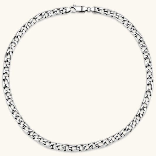 Chunky antique silver plated eco-brass curb chain necklace with a lobster clasp and Greek key detail on a cream background.